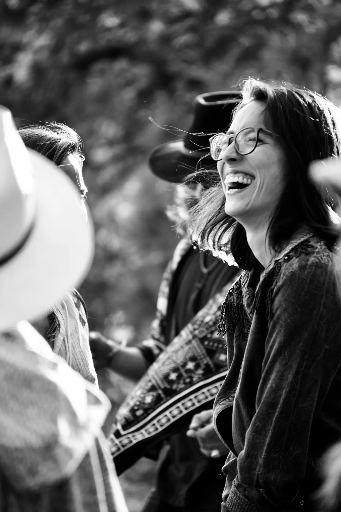 Friends laughing together, black and white
